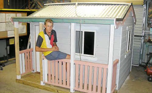 Warwick State High School student Johnathon Rock, who helped build the cubbyhouse, enjoys the end result. Warwick State High School student Johnathon Rock, who helped build the cubbyhouse, enjoys the end result.